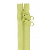 Green 30-inch zipper with two pull tabs and closed-end design.