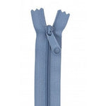 Blue 24-inch zipper with matching pull tab, shown partially open against white background.