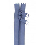 Blue 30-inch zipper with two pull tabs and decorative scalloped tape ends