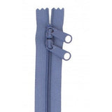 Blue 30-inch zipper with two pull tabs and decorative scalloped tape ends