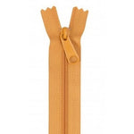 Orange 24-inch zipper with matching pull tab, shown fully open against white background.