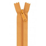 Orange 24-inch zipper with matching pull tab, shown fully open against white background.