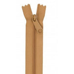 Golden brown closed-end zipper with matching pull tab and fabric tape