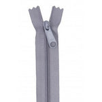 Gray zipper with matching pull tab, showing the zipper partially open at the top