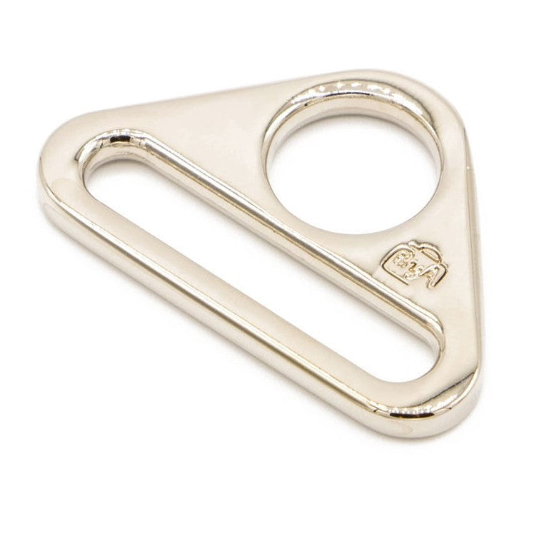 A triangular nickel-plated metal ring with a circular opening on one side and an elongated slot on the other.