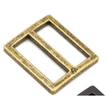 Antique brass rectangular slider buckle with weathered gold finish and central divider bar.