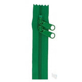 Green 30-inch zipper with dual pull tabs and zigzag tape edges.