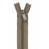 Khaki-colored 24-inch zipper with metal pull tab, shown partially open against white background.