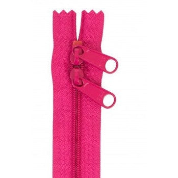 Bright pink 30-inch zipper with double pull tabs and decorative scalloped tape ends.