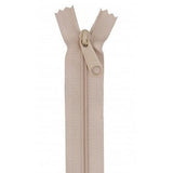 Beige or tan colored 24-inch zipper with matching pull tab, shown partially open against white background.