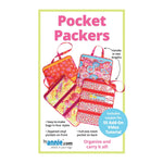 Colorful quilted travel organizer bags in pink, orange, and floral patterns with multiple zippered pockets and handles.