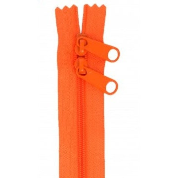 Bright orange zipper with two pull tabs, featuring a double-pull design for opening from either end.