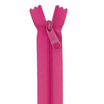 Bright pink zipper with matching pull tab, showing the opened zipper teeth at the top.