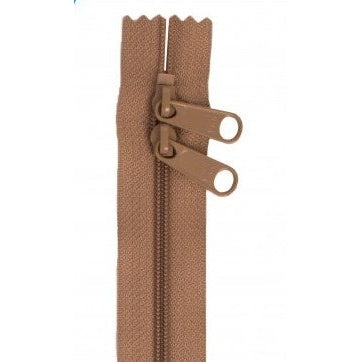 Brown 30-inch zipper with two pull tabs and scalloped tape edges.