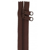 Brown 30-inch double pull zipper with two slider pulls and coil teeth design.
