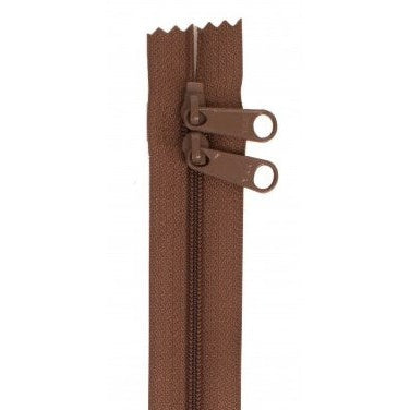 Brown zipper with two pull tabs, measuring 30 inches in length.