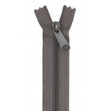A gray zipper with matching fabric tape and pull tab, shown partially open against a white background.
