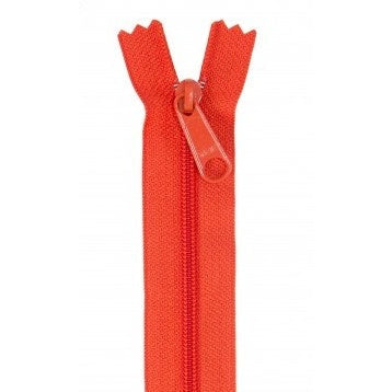 Bright orange-red zipper with matching pull tab, shown partially open against white background.