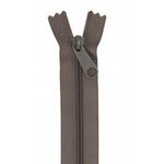 Taupe colored 24-inch zipper with dark brown teeth and matching pull tab shown fully closed.