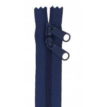 Navy blue 30-inch zipper with double pull tabs and decorative zigzag tape edges.