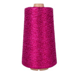 Spool of pink yarn on a white background