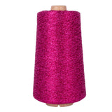 Spool of pink yarn on a white background