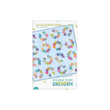 A quilt pattern cover showing a light blue quilt with colorful hexagonal Dresden plate blocks made from various patterned fabrics.