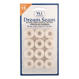 Package of 12 cream colored Dream Seam cotton thread bobbins in clear plastic blister pack