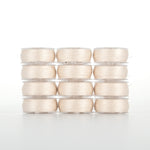 Light beige thread spools arranged in four rows of three, each spool wrapped in clear plastic packaging