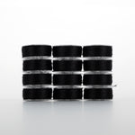 Twelve spools of black Dream Seam thread stacked in four rows of three, showing clear plastic bobbins with wound thread