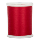 Red thread wound on white plastic spool with clear plastic top and bottom caps