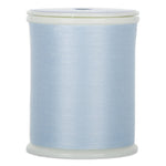 Light blue Dream Seam thread wound on white plastic spool with clear plastic ends
