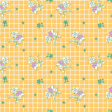 Yellow gridded background with bunches of white and purple flower