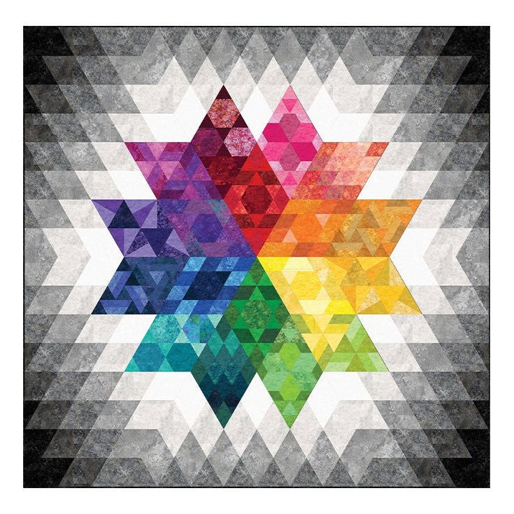 Colorful geometric quilt pattern featuring a large star design with rainbow triangular sections on a gray and white background.