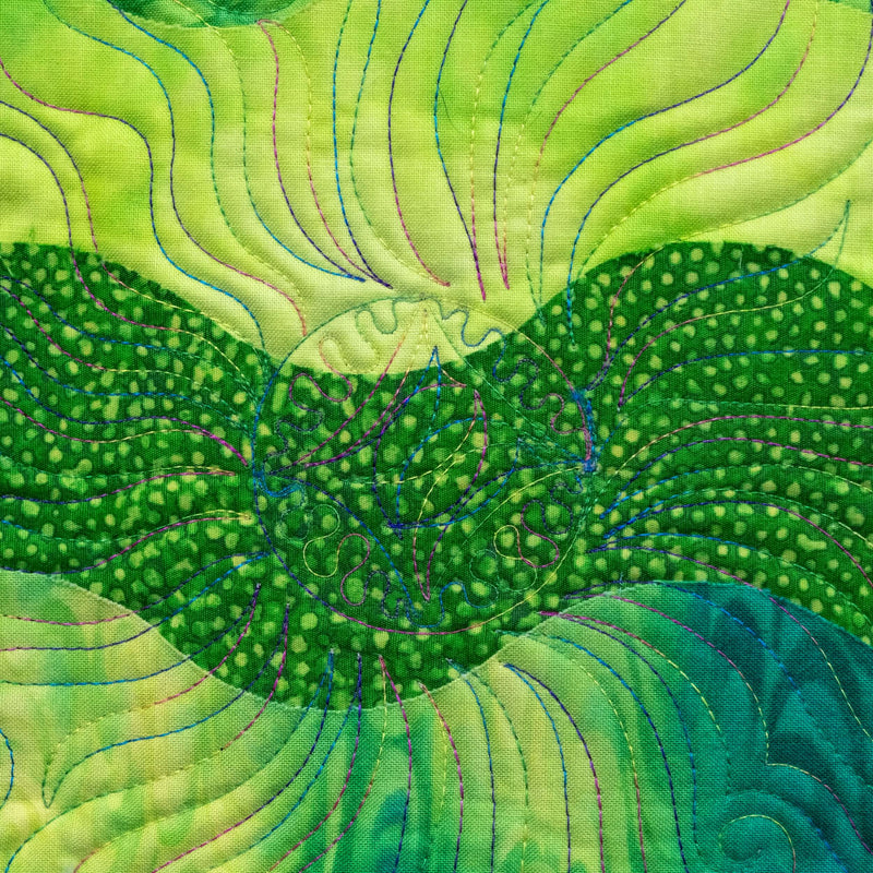 wavy green quilt block with variegated thread quilted