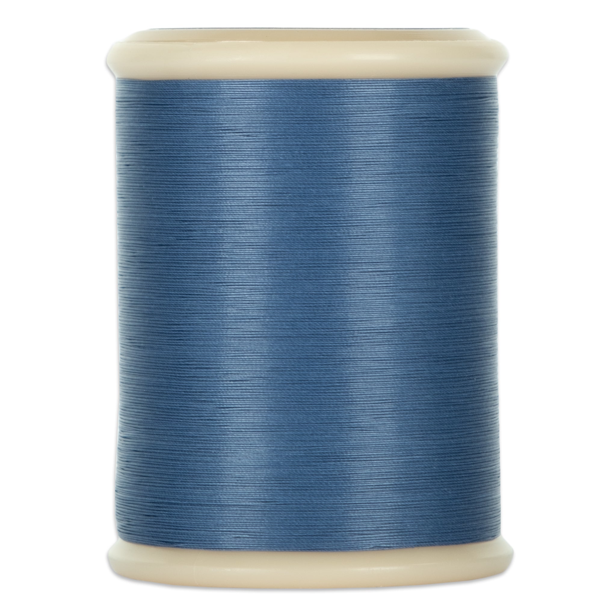 Gray blue hand quilting thread wound on white plastic spool with cream-colored ends