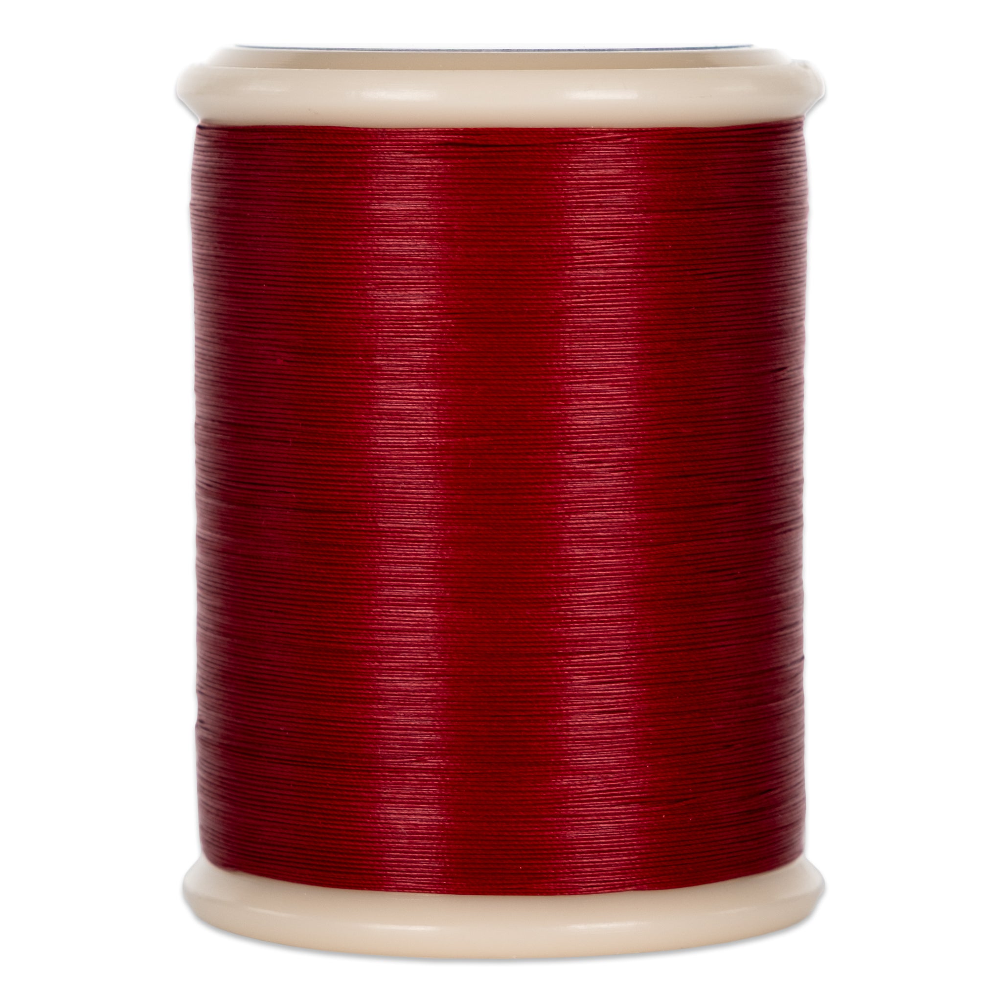 Red quilting thread wound on white plastic spool with visible thread texture and sheen