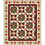 Traditional Christmas quilt with red and green geometric blocks, holly berry floral border, and cream background.