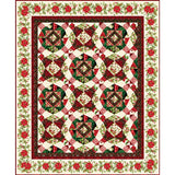 Traditional Christmas quilt with red and green geometric blocks, holly berry floral border, and cream background.