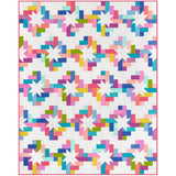 Colorful quilt kit featuring a modern star pattern with bright multicolored fabric pieces arranged in a geometric design on white background.