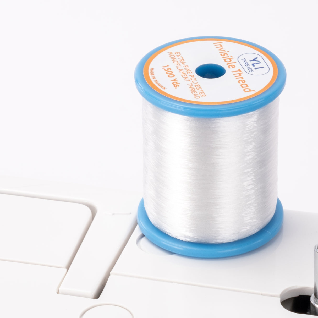 spool of invisible thread poly monofilament quilting thread on a sewing machine