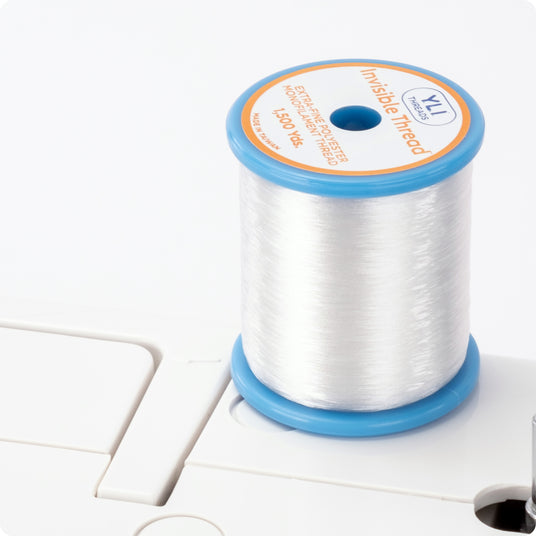 a spool of invisible thread poly on a sewing machine
