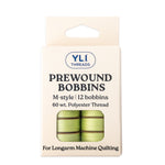 Light green M-style prewound bobbins for longarm quilting