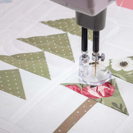 close up photo of quilting on a longarm machine