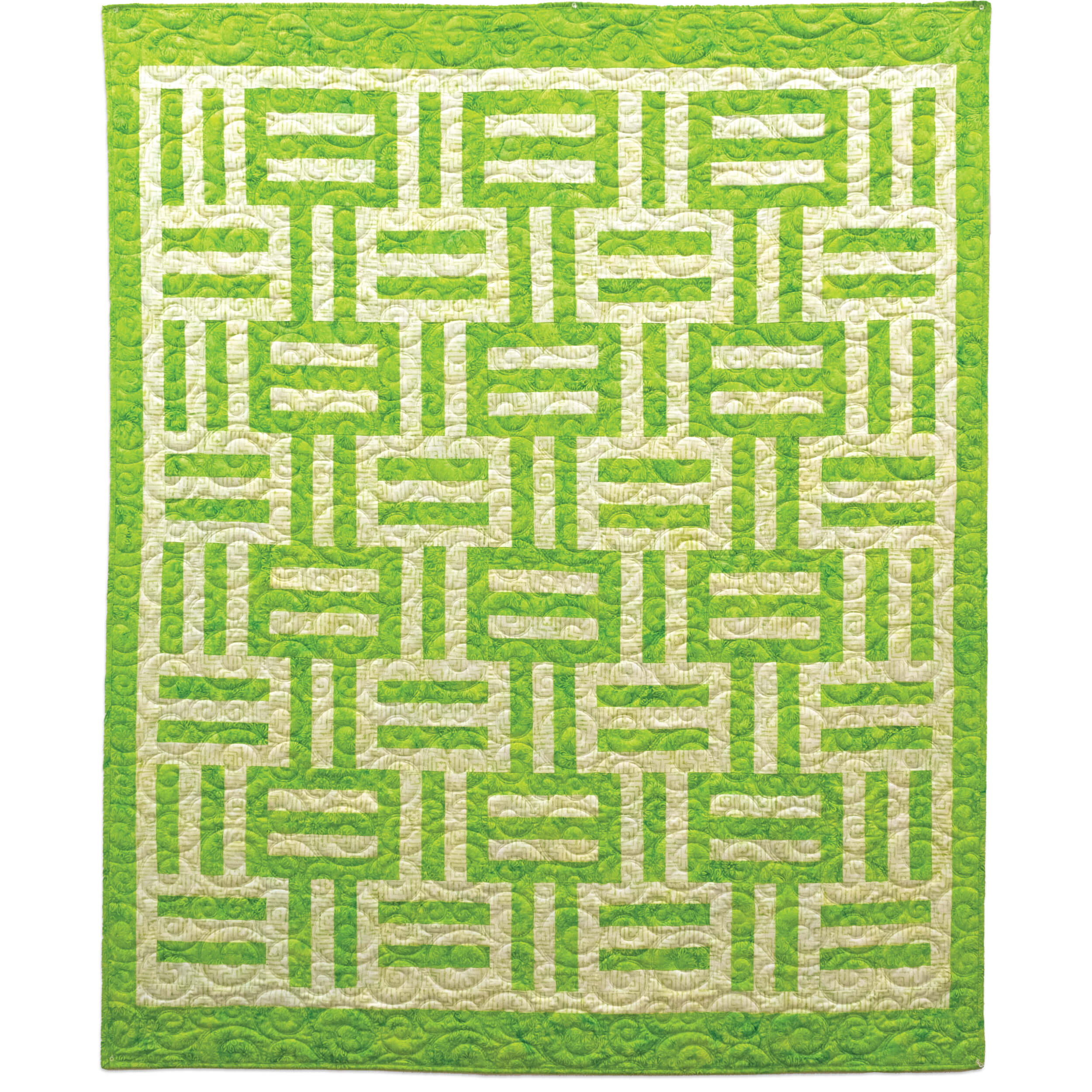 Green and cream batik quilt with geometric maze-like pattern featuring interlocking rectangular blocks and quilted texture