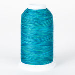 Blue variegated thread cone with multiple shades of turquoise and teal wound in crossing patterns