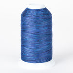 Blue variegated thread on white plastic cone with multiple shades of blue creating a marbled effect