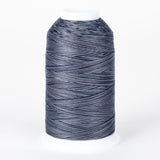 Nightfall variegated thread on white cone with dark blue, gray, and light blue multicolored strands wound in diagonal pattern