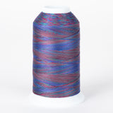 Multicolored variegated thread on white cone with blue, red, and purple strands creating a rainbow effect