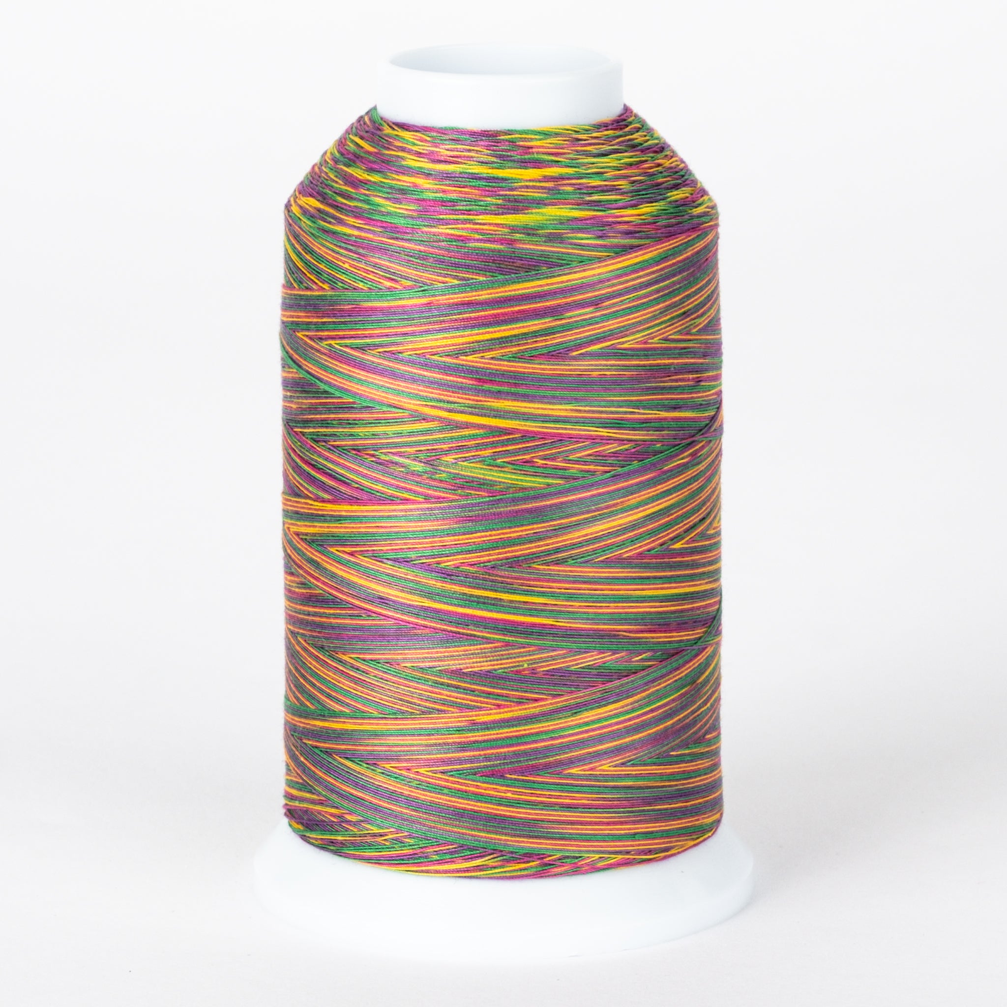 Multicolored variegated thread on white cone spool with vibrant rainbow stripes in yellow, purple, orange, and green